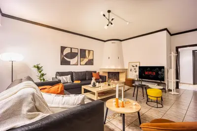 a living room with a couch and a fireplace at Perfect Stay in Gazi in Athens