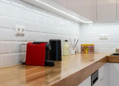 a red suitcase sitting on top of a kitchen counter at MZ Kolonaki in Athens