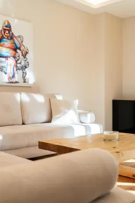 a living room with a couch and a table at MZ Kolonaki in Athens