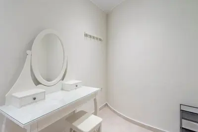 a white bathroom with a mirror and a sink at Modern apt at Thisio next to the metro station in Athens