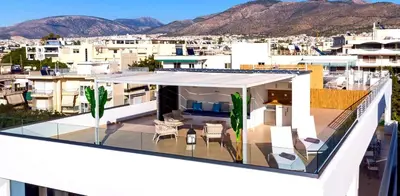 a balcony with a view of a city at Riviera Escape Penthouse Suites in Athens