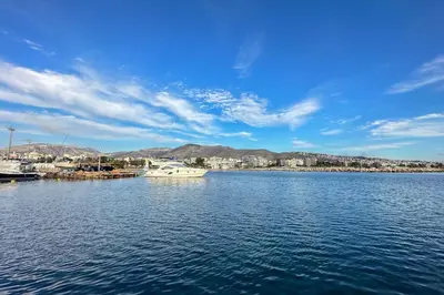 a view of a large body of water with boats at Riviera Escape Penthouse Suites in Athens