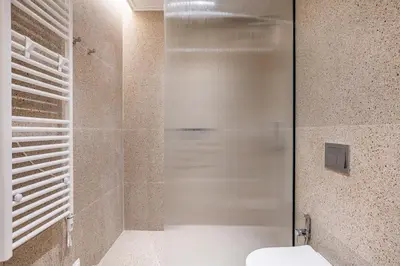 a shower stall with a toilet in a bathroom at The Emerald of Pagrati in Athens