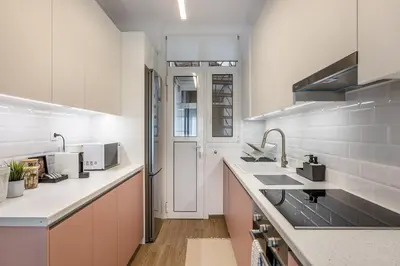 a kitchen with a sink and a counter top at The Emerald of Pagrati in Athens