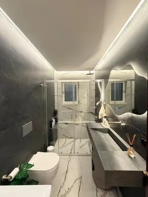 a bathroom with a sink and a toilet and a shower at Sea View apartment in Athens