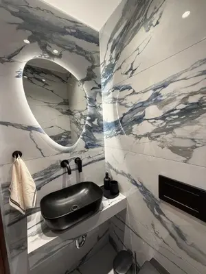a bathroom with a sink and a mirror at Sea View apartment in Athens