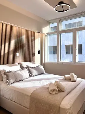 a bedroom with two large beds with towels on them at Monastiraki 304 SuperHost Hub in Athens