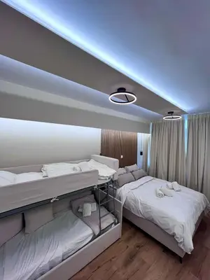 two beds in a room with lights on the wall at Monastiraki 304 SuperHost Hub in Athens