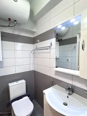 a bathroom with a white toilet and a sink at Monastiraki 304 SuperHost Hub in Athens
