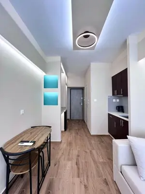 a living room with a table and a couch at Monastiraki 304 SuperHost Hub in Athens