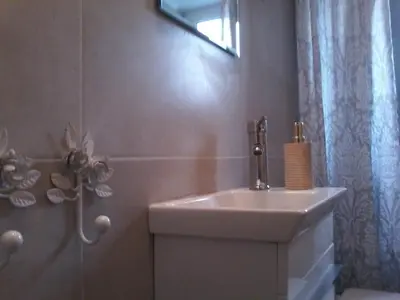a bathroom with a sink and a shower at super central-metro Acropolis in Athens