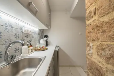 a small kitchen with a sink and a counter at DP Homes Exarcheia 1A in Athens