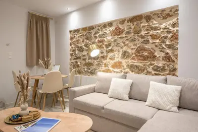 a living room with a couch and a table at DP Homes Exarcheia 1A in Athens