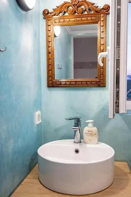 a bathroom with a white sink and a mirror at Acropolis Skyline Sunset, 2 person loft Exarchia in Athens