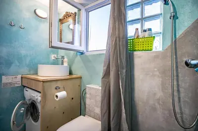 a bathroom with a shower and a toilet and a sink at Acropolis Skyline Sunset, 2 person loft Exarchia in Athens