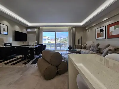 a living room with a couch and a table at Elegant VIP Apartment - Athens Town in Athens