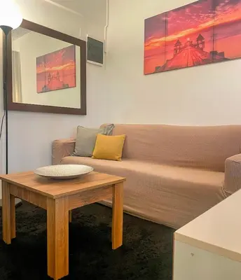 a living room with a couch and a coffee table at lemonsky apartment in Palaiá Fókaia