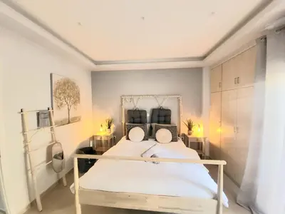 a bedroom with a white bed in a room at Glory Apartment 3is septemvriou in Athens