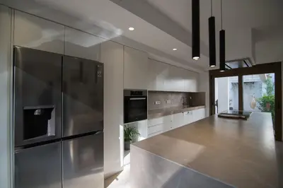 a kitchen with stainless steel appliances and a counter at Amuse Athens Villa in Vari