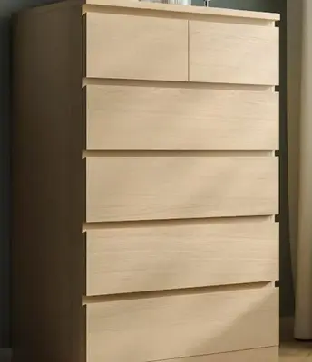 a wooden chest of drawers in a bedroom at Stylish and cosy apartment near the Acropolis in Athens