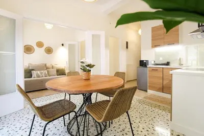 a kitchen and dining room with a table and chairs at Stylish and cosy apartment near the Acropolis in Athens