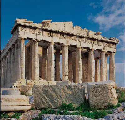 an ancient building with columns on a hill at Plaka Premier Stay - Steps from Acropolis Museum and Metro in Athens
