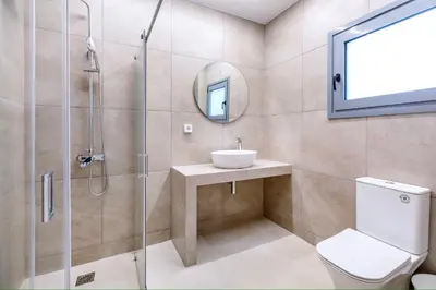 a bathroom with a shower and a toilet and a sink at M&H and their friends 1 in Athens