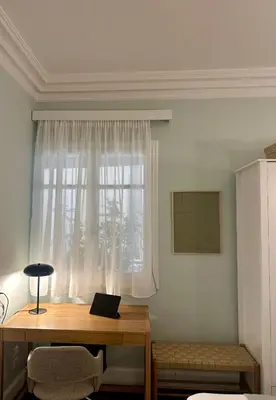 a room with a desk and a window with a laptop at Athens Heart Gem Lux Apartment in Athens
