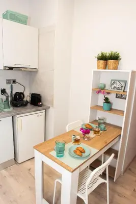 a small kitchen with a table with food on it at Kolonaki Prime Location Luxurius Flat in Athens