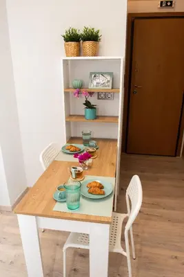 a dining room table with plates of food on it at Kolonaki Prime Location Luxurius Flat in Athens