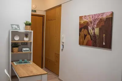 a room with a table and a painting on the wall at Kolonaki Prime Location Luxurius Flat in Athens