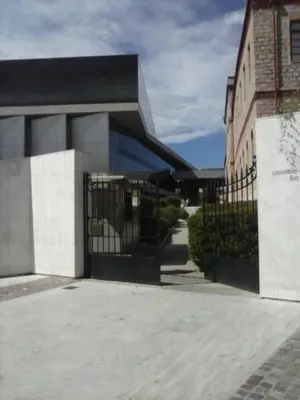 a building with a gate in front of a building at Acropolis Metro Station- Great Located Flat 125m2 in Athens
