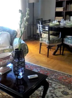 a living room with a vase on a coffee table at Acropolis Metro Station- Great Located Flat 125m2 in Athens