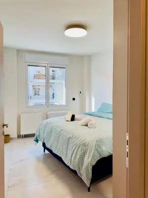 a bedroom with a bed and a window at Modern Designer Home & Stylish Comfort Goudi in Athens