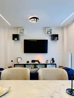 a conference room with chairs and a flat screen tv at Modern Designer Home & Stylish Comfort Goudi in Athens