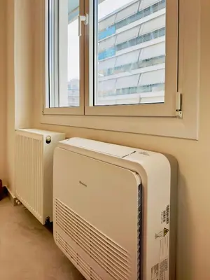 a room with a radiator and a window at Modern Designer Home & Stylish Comfort Goudi in Athens