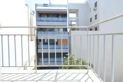 a view of a building from a balcony at Modern two bedroom apartment Stili Olympioy Dios in Athens
