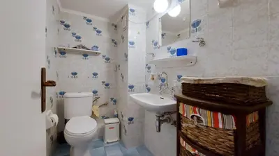 a small bathroom with a toilet and a sink at Cholargos a Spacious 2BR apartment with great view in Athens
