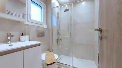 a bathroom with a shower and a toilet and a sink at A modern and bright apartment in Kolonaki in Athens