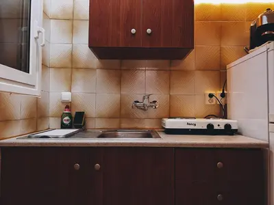 a kitchen with a sink and a counter top at Budget and private flat in Aristotelous in Athens