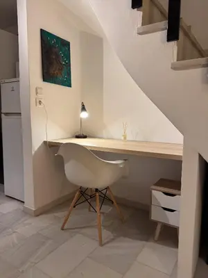 a white desk with a chair in a room at Cozy Seaside Stay Renovated & Peaceful in Porto Rafti