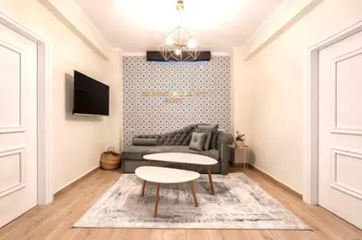 a living room with a couch and a table at Athens Acropolis Markella in Athens