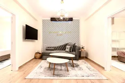 a living room with a couch and a table at Athens Acropolis Markella in Athens