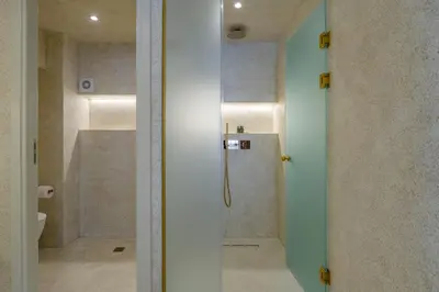 a bathroom with a shower and a toilet at Minimalist Oasis in Athens in Athens