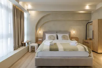 a bedroom with a large bed in a room at Minimalist Oasis in Athens in Athens