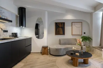 a living room with a couch and a table at Urban Serenity Suite in Athens in Athens