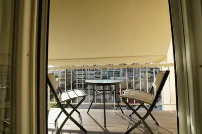a view of a balcony with a table and chairs at New Delightful Apartment in Athens