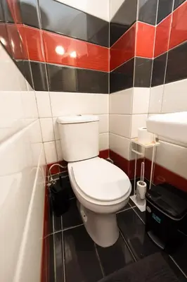 a bathroom with a white toilet and a sink at Gazi Square Apartment in Athens