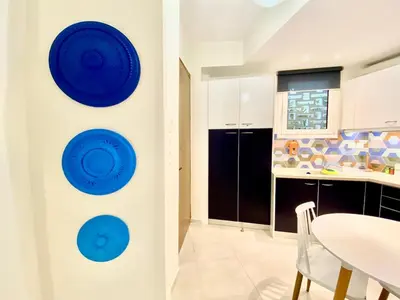 a kitchen with blue plates on the wall at Glyfada SEASIDE South Athens Philoxenia In Athens in Athens