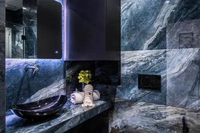 a bathroom with a black sink and a mirror at Elegant, Spacious and hitech apt at Koukaki in Athens